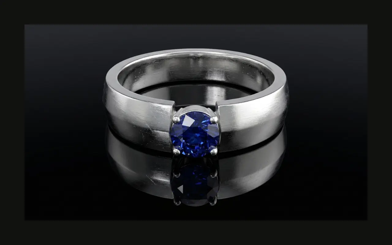 3D rendered minimalist silver ring with bezel-set oval blue sapphire — Arvion Designs